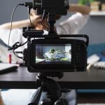 woman-making-beauty-vlog-with-her-professional-camera